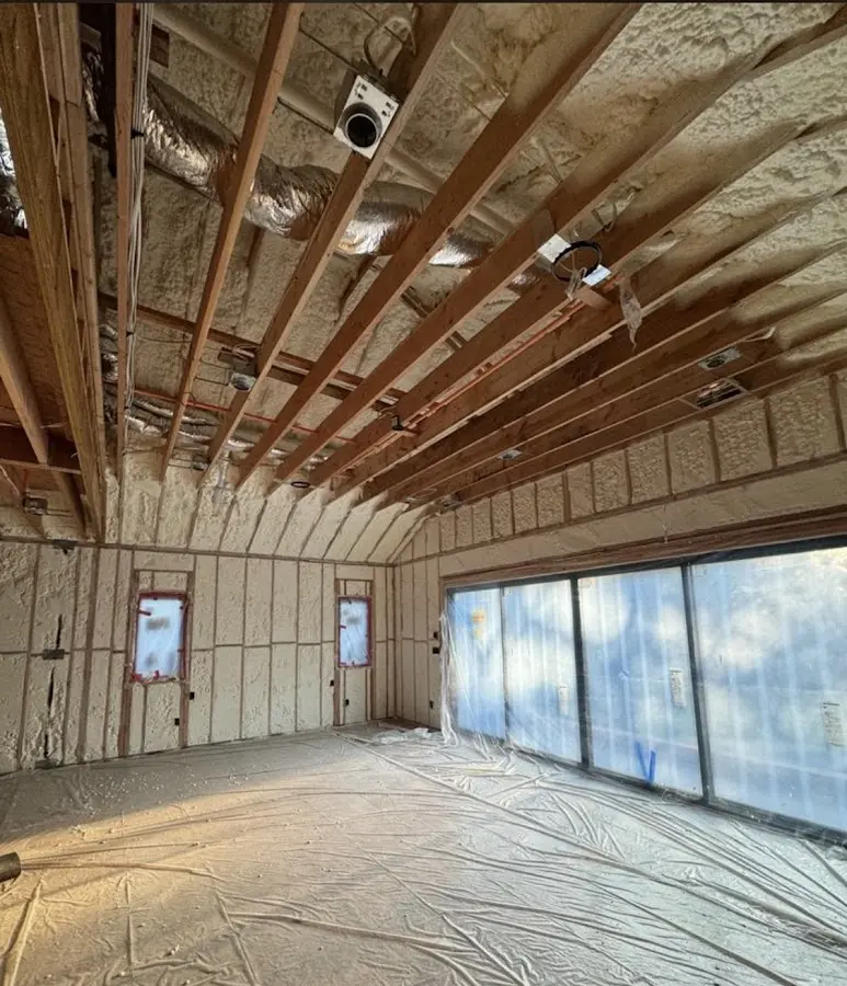 Interior walls and ceiling insulated with spray foam during new construction in Ferguson